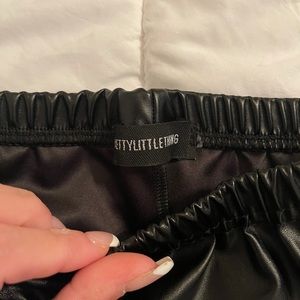 {Pretty Little Thing Black Faux Leather Flare Slit Pants}